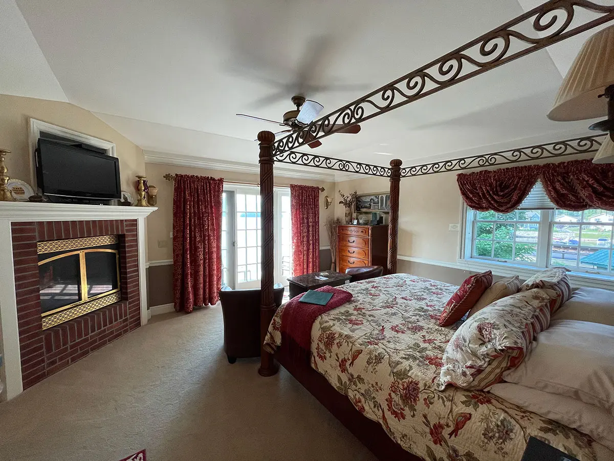 Isabella's 'Sweet' Room four-post bed and fireplace