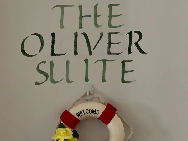 The Oliver Suite room sign